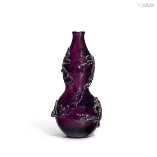 A RARE TRANSPARENT PURPLE GLASS GOURD-SHAPE VASE   Qing dyna...