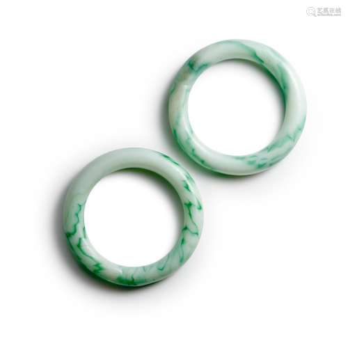 A PAIR OF OPAQUE WHITE AND GREEN GLASS BRACLETS Qing dynasty...