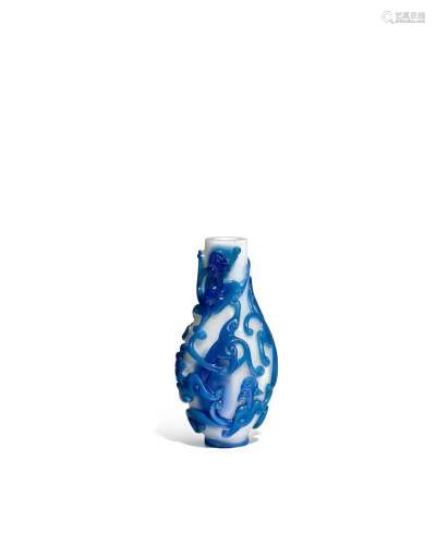 AN UNUSUAL BLUE OVERLAY AND OPAQUE WHITE GLASS OVIFORM '...
