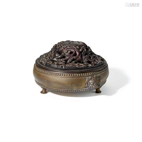 A DRUM-FORM BRONZE TRIPOD CENSER Xuande Mark, late Qing dyna...