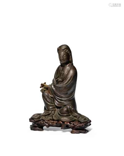 A LARGE SILVER-INLAID BRONZE FIGURE OF GUANYIN Mid-Qing dyna...