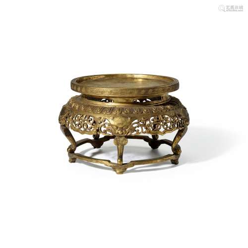 A CAST AND REPOUSSE GILT-COPPER FIVE-LEGGED CIRCULAR STAND  ...