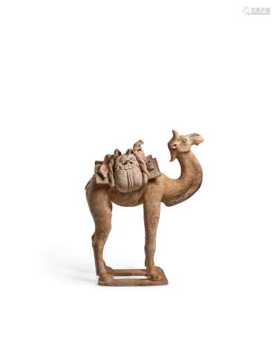 A MASSIVE AND RARE BUFF POTTERY FIGURE OF A CAMEL AND MONKEY...