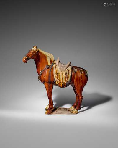 A SUPERB LARGE OCHRE, STRAW AND BLACK-GLAZED CAPARISONED FER...