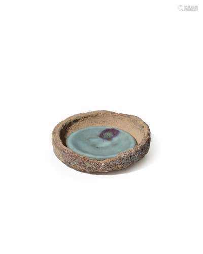 A SAGGAR CONTAINING A PURPLE-SPLASHED JUN DISH Jin dynasty