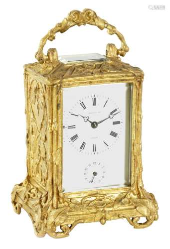 A MID 19TH CENTURY FRENCH GILT BRASS STRIKING CARRIAGE CLOCK