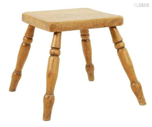 A 19TH CENTURY SYCAMORE FOUR LEGGED MILKING STOOL