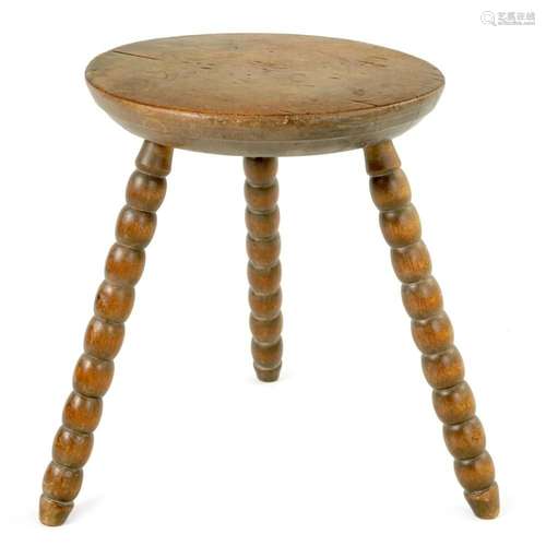 AN EARLY 20TH CENTURY FRENCH SMALL OAK BOBBIN STOOL