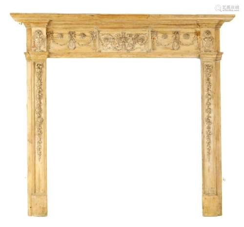 AN 18TH CENTURY CARVED PINE ADAM-STYLE FIRE SURROUND