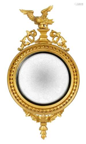 A LARGE REGENCY CARVED GILT WOOD CONVEX HANGING MIRROR