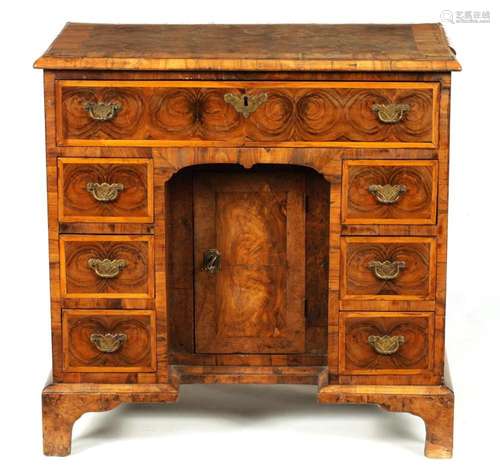 AN EARLY 18TH CENTURY OYSTER VENEERED LABURNUM KNEEHOLE DESK