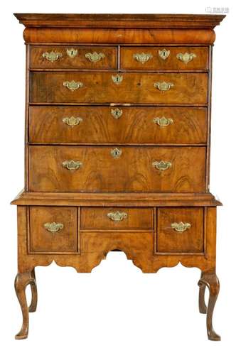 AN EARLY 18TH CENTURY HERRINGBONE-BANDED FIGURED WALNUT CHES...