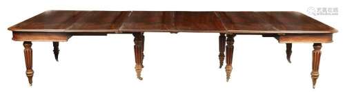 A REGENCY FIGURED MAHOGANY EXTENDING DINING TABLE IN THE MAN...