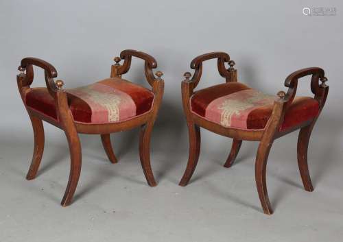A pair of early Victorian mahogany framed stools with shaped...