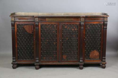 A Regency rosewood and brass inlaid breakfront side cabinet