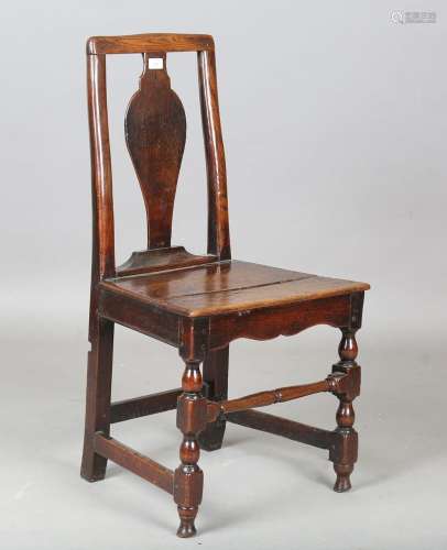 An early 18th century Welsh oak and ash vase back side chair...