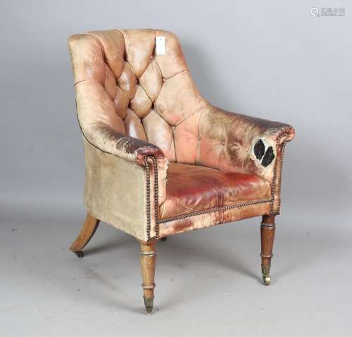 A William IV mahogany scroll arm library chair with buttoned...
