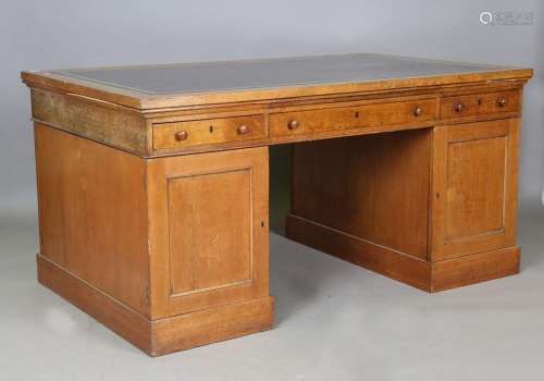 A Victorian pale oak twin pedestal partners desk