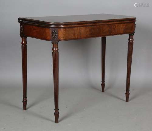 A fine George IV figured mahogany fold-over tea table