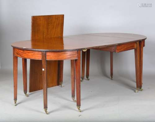A George III mahogany D-end dining table with central drop-f...
