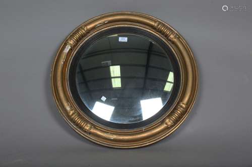A 19th century gilt painted circular convex wall mirror