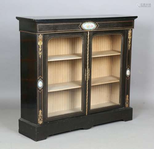 A late Victorian ebonized pier cabinet with gilt metal mount...