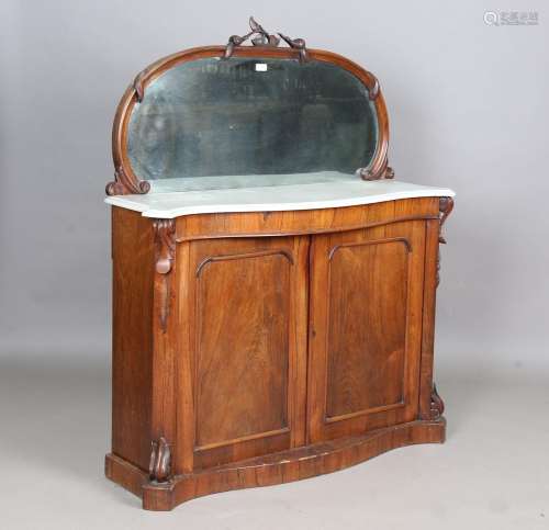 A mid-Victorian rosewood serpentine fronted chiffonier with ...