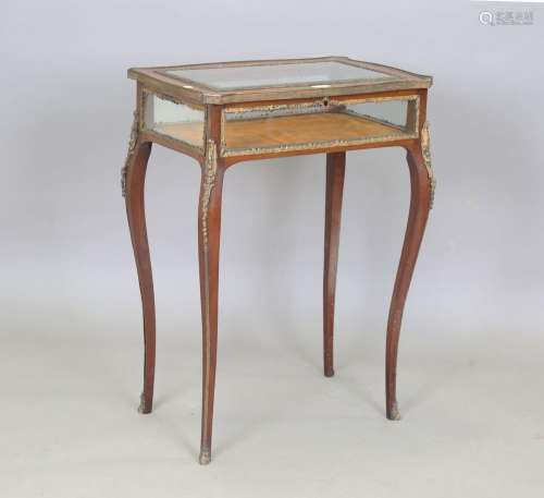 A late 19th/early 20th century mahogany and gilt metal mount...