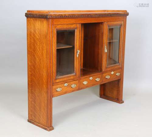 An Edwardian oak cabinet top