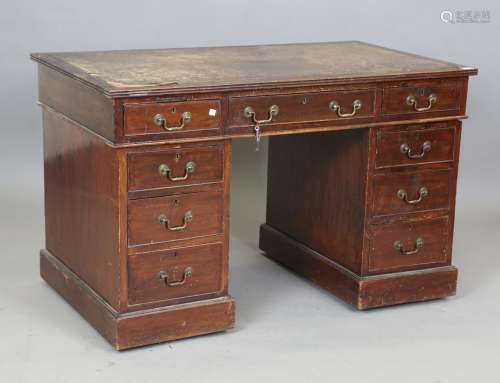 An early 20th century mahogany twin pedestal desk