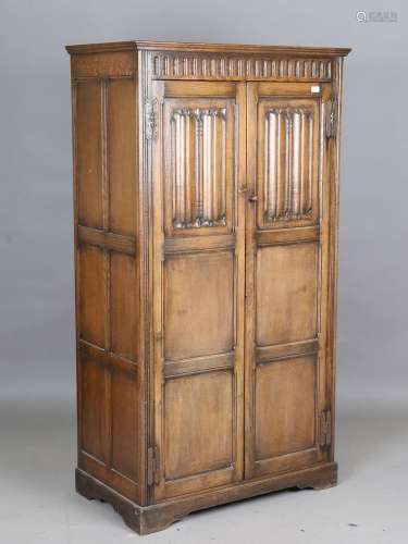 A mid-20th century Jacobean Revival oak wardrobe