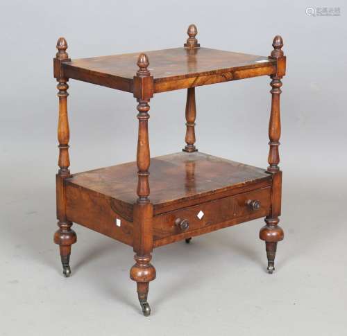 A late Victorian walnut two-tier whatnot with turned acorn f...
