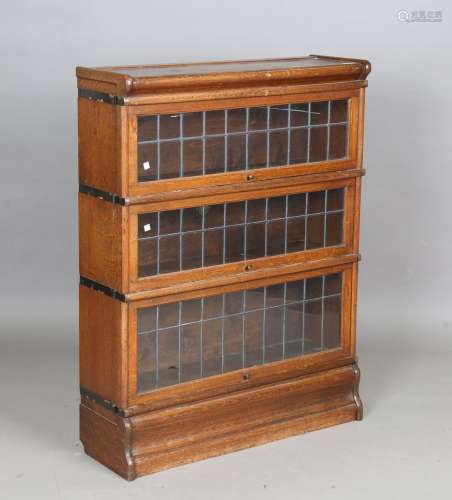 An early 20th century oak Globe Wernicke three-tier bookcase...
