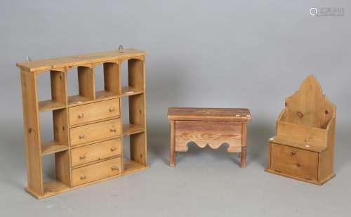 A 20th century pine wall shelf with four central drawers