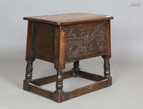 A 20th century Carolean Revival oak box seat joint stool
