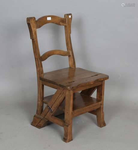 A late 20th century walnut metamorphic library chair