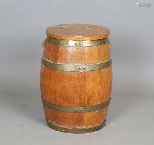 A mid-20th century coopered oak barrel with hinged lid