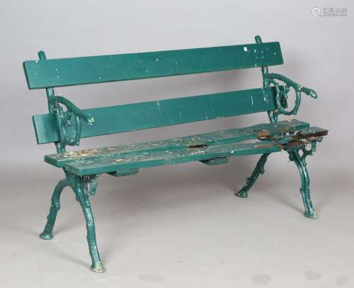 A Victorian green painted cast iron and wooden slatted garde...