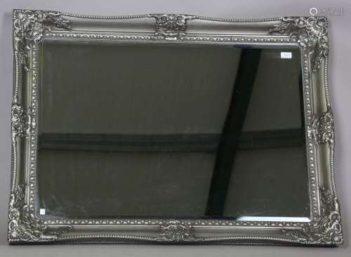 A large modern rectangular wall mirror with silvered relief ...