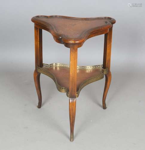 A 20th century mahogany two-tier occasional table of triform...