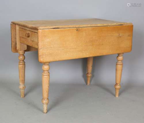 A Victorian pine drop-flap kitchen table