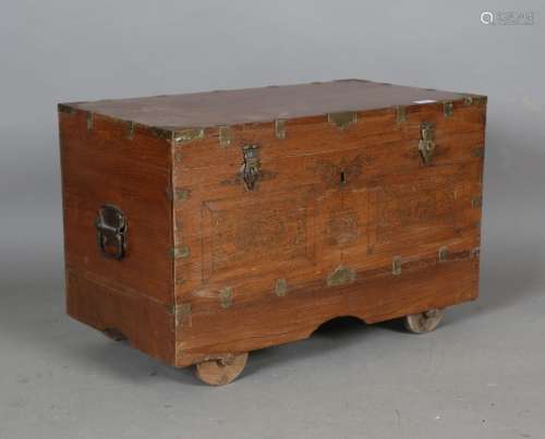 A 20th century Indian teak and brass inlaid dressing trunk
