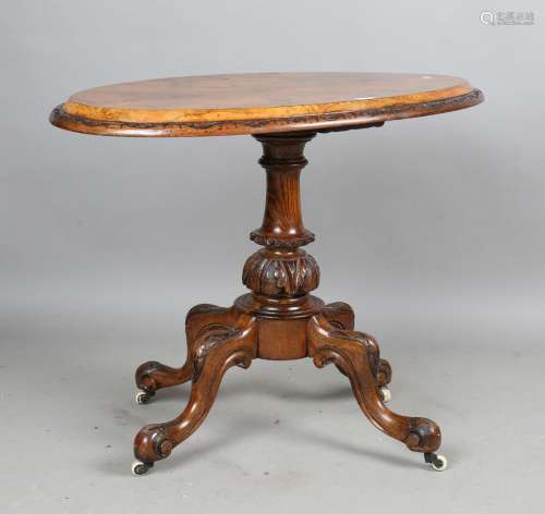A late Victorian walnut oval loo table