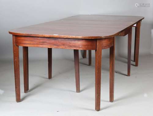 A late George III mahogany 'D' end dining table with central...