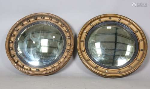 A pair of 19th century Regency style gilt painted circular c...