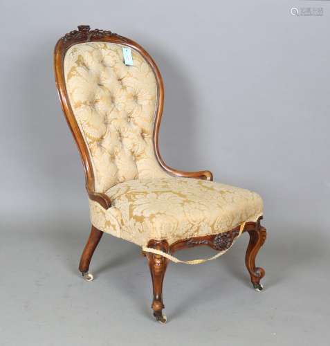 A mid-Victorian walnut framed lady's salon chair