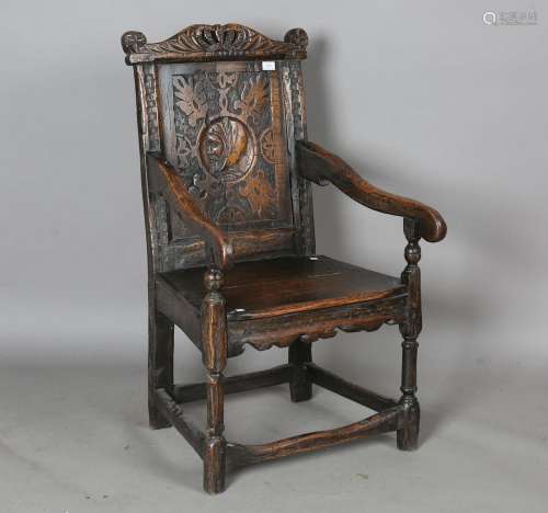 A 20th century Carolean Revival oak Wainscot armchair