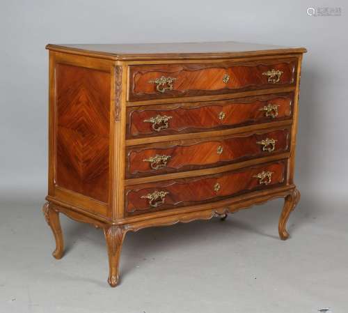 A 20th century French walnut chest of four drawers