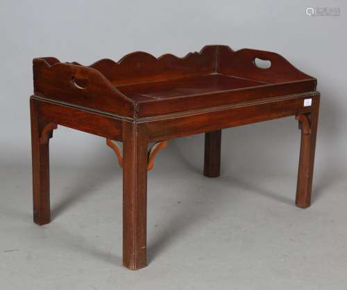 A 19th century mahogany butler's tray with pierced raised ga...