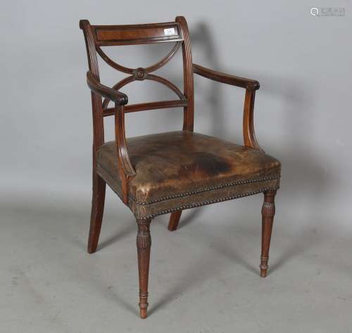 A George III mahogany bar back elbow chair with 'X' frame ce...